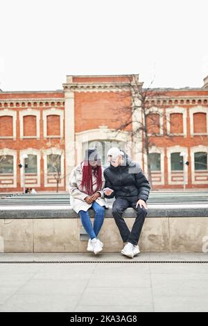 smiling young Multiethnic couple on the street. Stock Photo
