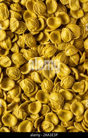 Full frame top view of fresh savory Turmeric orecchitte paste scattered on surface Stock Photo