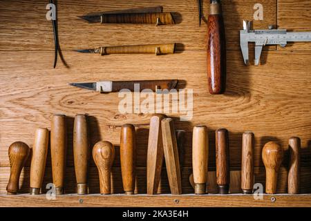 Top view of arranged in order assorted tools for manufacturing musical instruments in luthier workshop Stock Photo