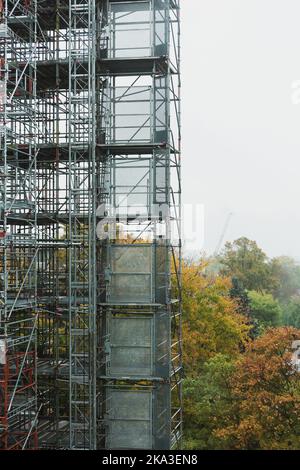 Scaffolding around modern building during renovations Stock Photo