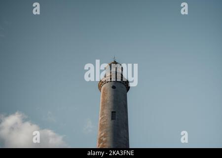 From below Maspalomas Lighthouse located against blue sky in Gran Canaria, Spain Stock Photo