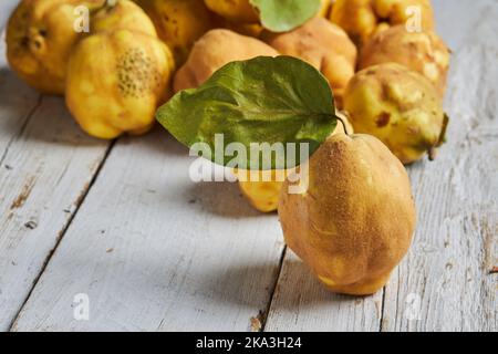 Fresh whole sour yellow lemons on white wooden background Stock Photo