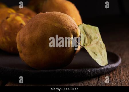 Fresh whole sour yellow lemons on wooden background Stock Photo