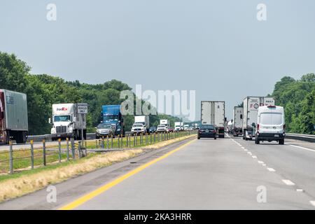 Brinkley, USA - June 4, 2019: Highway i40 interstate road in Arkansas with heavy traffic of many cars trucks driving point of view pov in summer Stock Photo