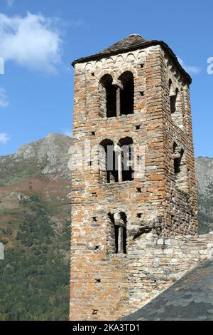 The Romanesque Church Tower of Saint Pierre in Early Autumn, Mérens-les-Vals, Ariège, Pyrenees, France Stock Photo
