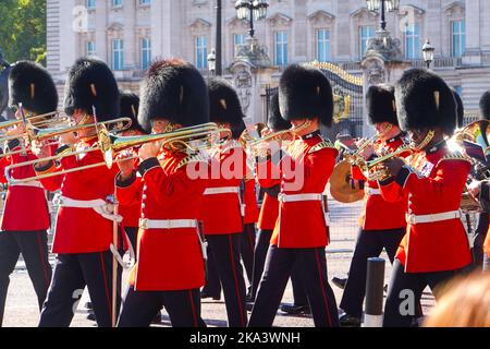 Brass section of band marching in the traditional changing of the guard ceremony in front of Buckingham Palace, London. Stock Photo