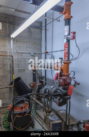 A closeup o fire sprinkler valves in a commercial building Stock Photo