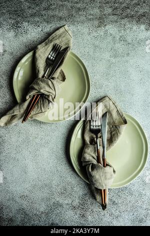 Overhead view of two minimalistic place settings on a table Stock Photo