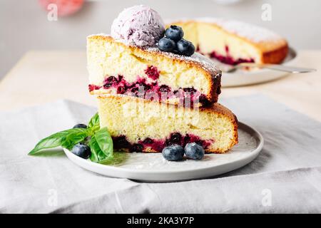 Blueberry lemon sponge cake in a plate, close-up. Stock Photo