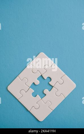 Jigsaw puzzle pieces forming partial figure. Stock Photo