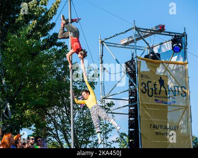Montreal, Canada - July 2 2022: 3 Geants Cirque in Completement Cirque Festival in Montreal Downtown Stock Photo