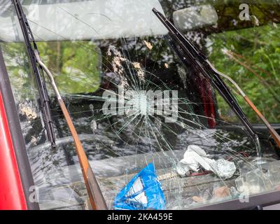 broken windscreen on a old van with worn and rusty windscreen wipers Stock Photo