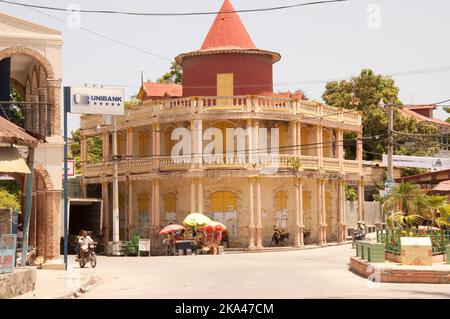 Colonial Style Building (icon of Jacmel) and street scene, Jacmel, Haiti.  Jacmel is an important port for the whole of Haiti and was a very rich town Stock Photo