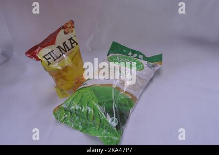 Packaged rice and cooking oil on a white background Stock Photo