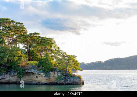 Matsushima Bay in dusk, beautiful islands covered with pine trees and rocks. One of the Three Views of Japan Stock Photo