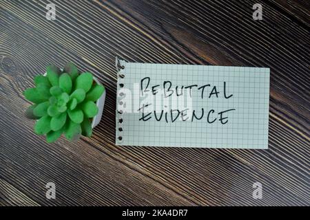 Concept of Rebuttal Evidence write on sticky notes isolated on Wooden Table. Stock Photo