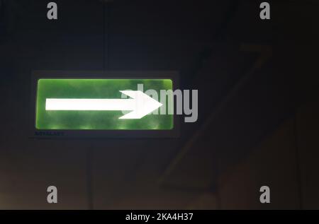Glowing board, emergency exit sign in the building. Security concept. Stock Photo