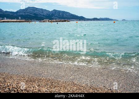 Gorgeous gentle day on the French Riviera - calm light waves and the sun sparkling in the water (this is a reflection). This - suburb of Marseille Stock Photo