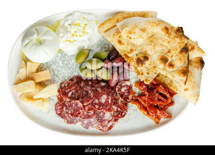 Antipasto platter with different cheese, meat and focaccia. Isolated on white background Stock Photo