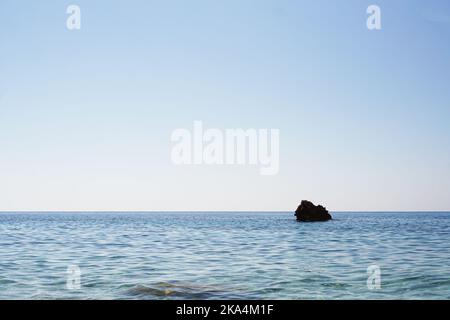 Small rocky Island in the sea. Holidays in Turkey. Sea cruise. Photo on a hot summer day Stock Photo
