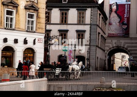 Viennese Fiakers two-horse drawn carriages are a part of the landscape of the capitol city in Austria. Stock Photo