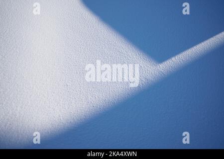 Shadows on white snowy ground Stock Photo