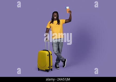 Cheerful african american young man tourist travelling alone Stock Photo