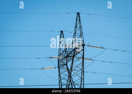 Close up of a electricity transmission tower or pylon. Stock Photo