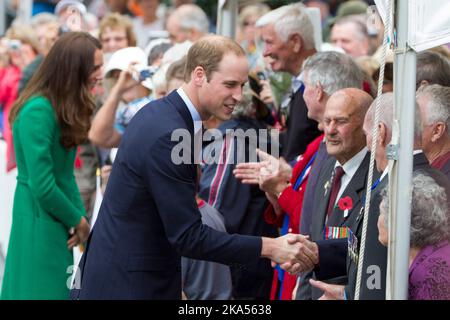 The Duke and Duchess of Cambridge meet members of the public after placing two roses on the War Memorial, Cambridge, New Zealand, Saturday, April 12, Stock Photo