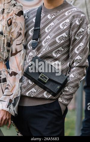 Milan, Italy - September, 21, 2022: Stylish man and woman wearing skirt, top and bags from fendi, street style outfit Stock Photo