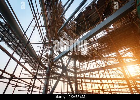 Silhouettes of scaffolding on sunset Stock Photo