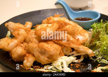 Chinese fried squid in batter, Hong Kong, China. Stock Photo