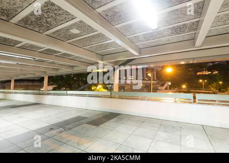 Covered walkway over railway tracs Stock Photo