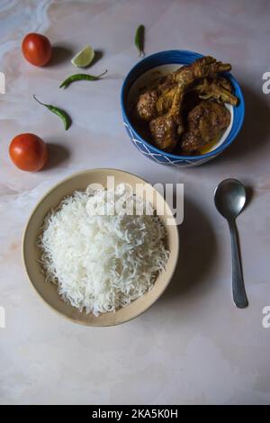 Indian meal steamed rice and chicken curry served. Top view Stock Photo