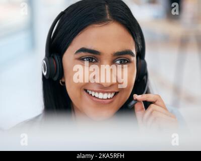 Telemarketing, happy and woman networking in a call center talking, communication and speaking into microphone. Smile, contact us and Indian girl Stock Photo