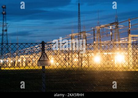 Landesbergen, Germany. 01st Nov, 2022. A sign reading High Voltage Danger to Life hangs on a fence in front of the Landesbergen substation. Chancellor Scholz has announced key points for relieving the burden on citizens and companies in the energy crisis. Credit: Lino Mirgeler/dpa/Alamy Live News Stock Photo