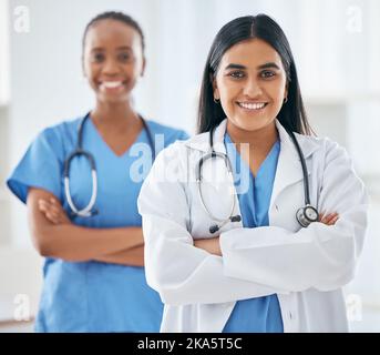 Happy, portrait and women doctors in collaboration standing with crossed arms in hospital, Happiness, teamwork and leadership of healthcare workers Stock Photo