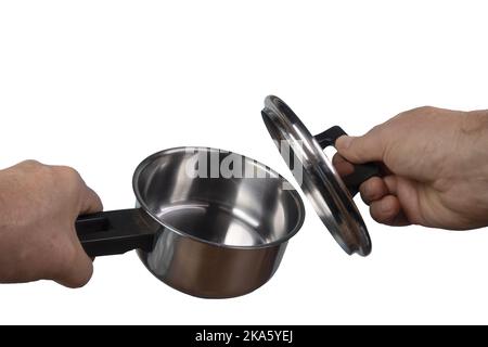 a pan and a steel lid in the hands of a man on a transparent background Stock Photo