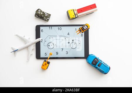 different types of toy transport and a tablet Stock Photo