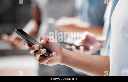 Hands of group in line on smartphone, social media or internet surfing or browsing online. Tech, side view and friends or people on devices, phones or Stock Photo