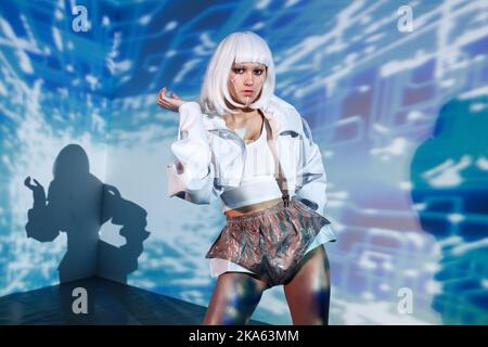Woman avatar having virtual reality experience. Augmented reality game, future technology, VR. AI concept. Stock Photo