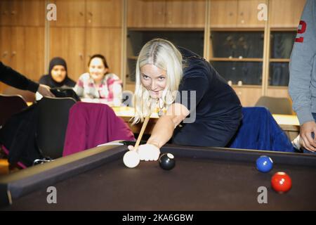 OSLO, Norway 20160301. Crown Princess Mette-Marit playing pool during the opening of new Furuset library and activity center Tuesday. Photo: Cornelius Poppe / NTB scanpix Stock Photo