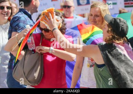 Oslo 20160625. Children and Equality Minister Solveig Horne (FRP) gets a cake in the face from a British woman under Oslo Pride Parade on Saturday. Photo: Erik Fosheim Brand Borg / NTB scanpix Stock Photo