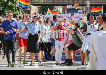 Oslo 20160625. Children- and Equality Minister Solveig Horne (FRP) gets a cake in the face from a British woman under Oslo Pride Parade on Saturday. Photo: Erik Fosheim Brand Borg / NTB scanpix Stock Photo