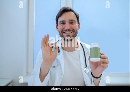Doctor approving a nutritional supplement during the consultation Stock Photo
