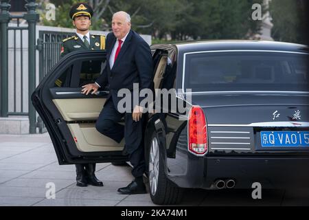 Beijing, China 20181016. King Harlad steps out of Hongqi L5. Hongqi L5 is the car the Royal Couple is being driven around in during the ongoing state visit in the country. Hongqi has taken its name from a communist symbol, but is now the most expensive car produced in China. The top model L5 has a price tag of close to 6 million kroner, is 5.55 meters long and over two meters wide. In general, the car weighs a total of 3.2 tonnes, but the reinforced version in which the Royal Couple sits weighs far more. The retro-style vehicle is also the official 'state-of-the-art' in China, and is also use Stock Photo