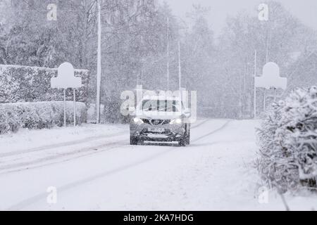 Car driving in snow - Scotland, UK Stock Photo