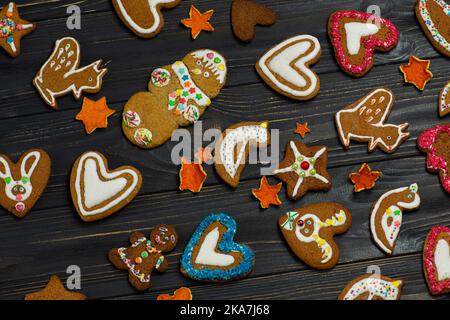 Collection of various gingerbread men. Festive concept with Christmas homemade gingerbread cookies. Stock Photo