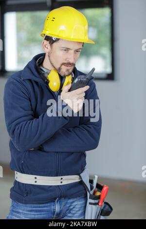 male engineer with walkie talkie indoors Stock Photo