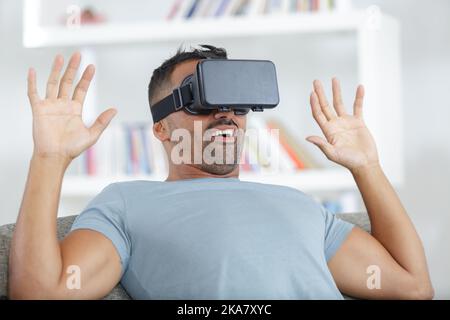 man wearing virtual reality using a vr headset Stock Photo